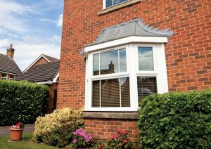 side of home with bay window