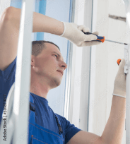 man installing door hardware