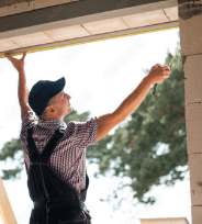 man measuring up a window