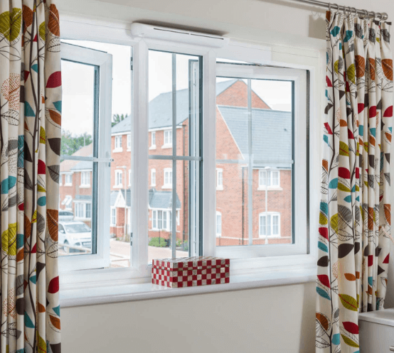 windows with contemporary leaf style curtains