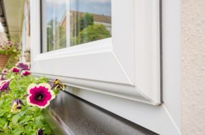 PVC-u window next to flowers